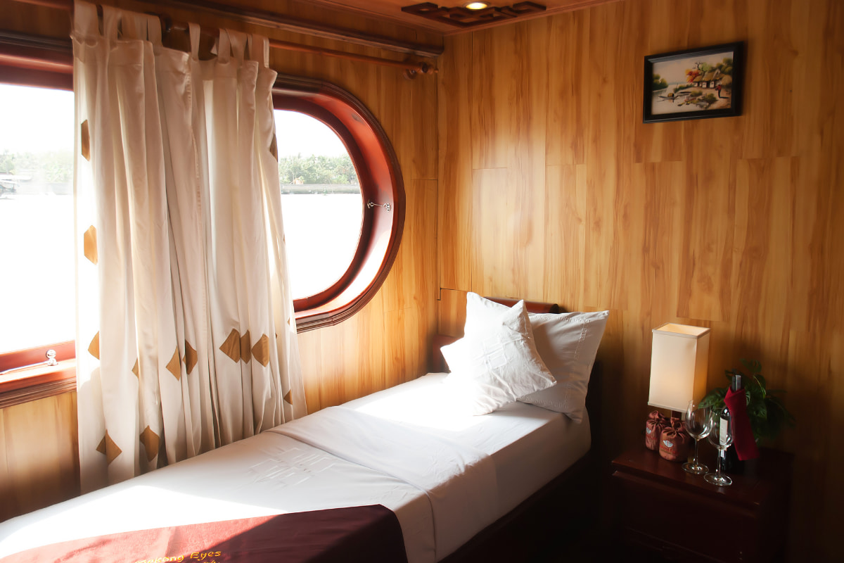 Cabine confortable en croisière dans le delta du Mékong